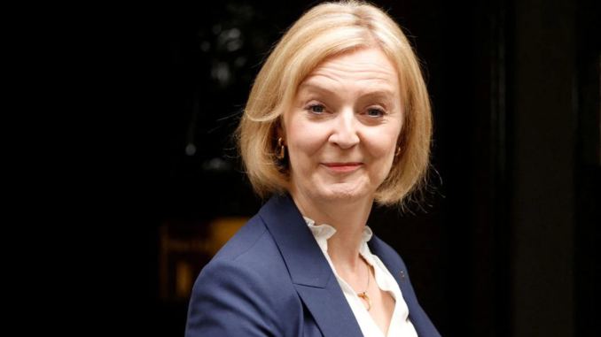 New British Prime Minister Liz Truss walks outside Number 10 Downing Street