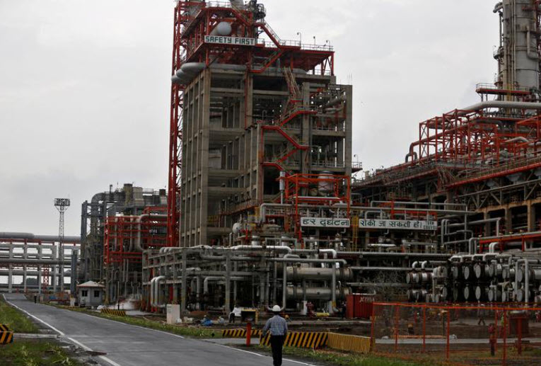 An employee walks inside the premises of an oil refinery of Essar Oil in Vadinar in the western state of Gujarat- India- October 4 2016. REUTERS- Amit Dave