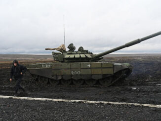 Russian Walking near a battle tank near Ukraine - ENB