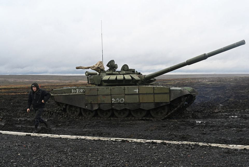Russian Walking near a battle tank near Ukraine - ENB