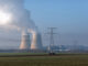 Cooling towers release water vapor beyond high tension electricity lines at the Nogent nuclear power plant in Nogent-sur-Seine, France, Dec. 21, 2021. -ENB