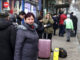 Ukraine - Residents with belongings wait for public transport