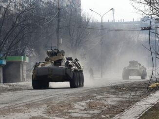 Tanks and bodies mark path of Russian retreat near Kyiv