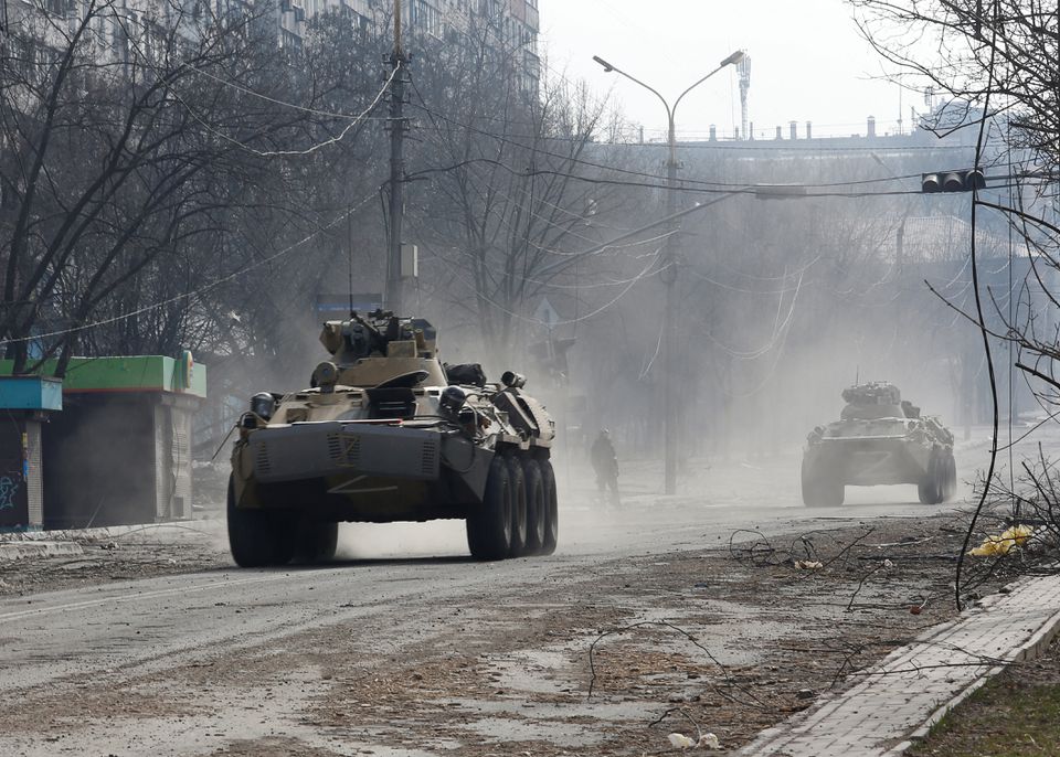 Tanks and bodies mark path of Russian retreat near Kyiv