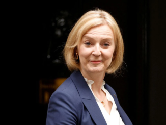 New British Prime Minister Liz Truss walks outside Number 10 Downing Street