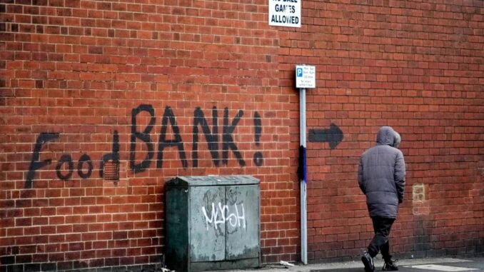 Who is bearing the brunt of the UK's economic downturn?