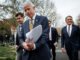 Energy Secretary Chris Wright, left, and Interior Secretary Doug Burgum, right, head back into the West Wing after speaking to reporters at the White House in Washington, on March 19, 2025. Burgum and Wright met with President Donald Trump and executives from the oil and gas industries at the White House. | Samuel Corum/Sipa USA