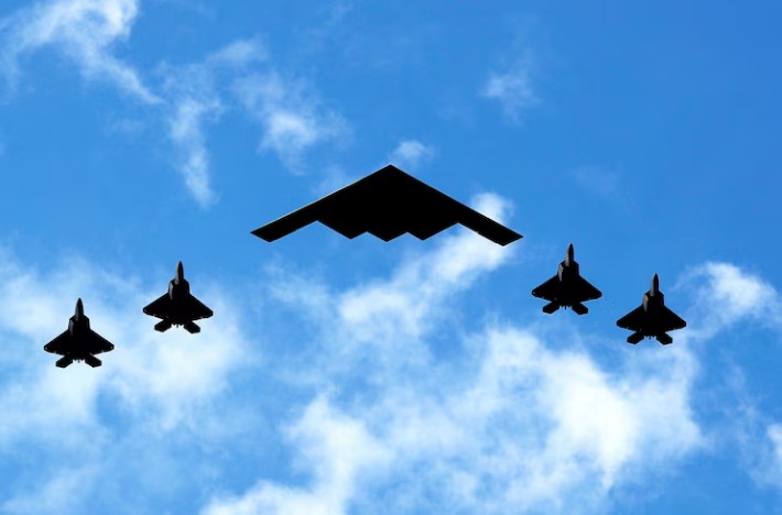 July 4 2020, file photo US Air Force B-2 flanked by US Marine Corps F-35