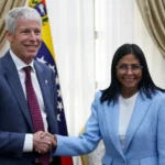 Venezuela's interim President Delcy Rodriguez shakes hands with US Energy Secretary Chris Wright on February 11 Leonardo Fernandez Viloria Reuters