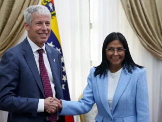 Venezuela's interim President Delcy Rodriguez shakes hands with US Energy Secretary Chris Wright on February 11 Leonardo Fernandez Viloria Reuters